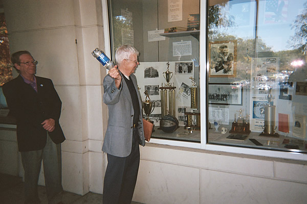 Thomas C. Murray "christens" the exhibit with a bottle of water

Photo from Tom Murray
