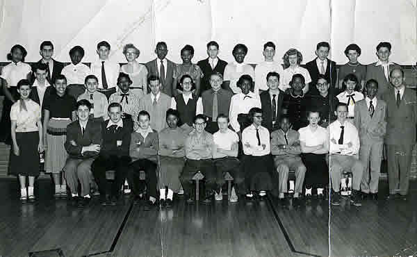 1954 January
Barbara Jones Taylo top row, forth from right. Margaret Kelleher, top row second from right and Sidney Krueger our teacher standing on right. 
